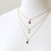 Delicate gemstone necklaces, layered