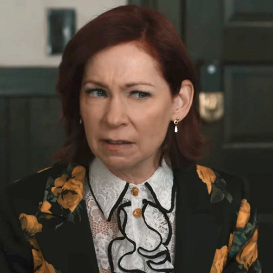 Carrie Preston as Elsbeth wearing small gold dangle earrings