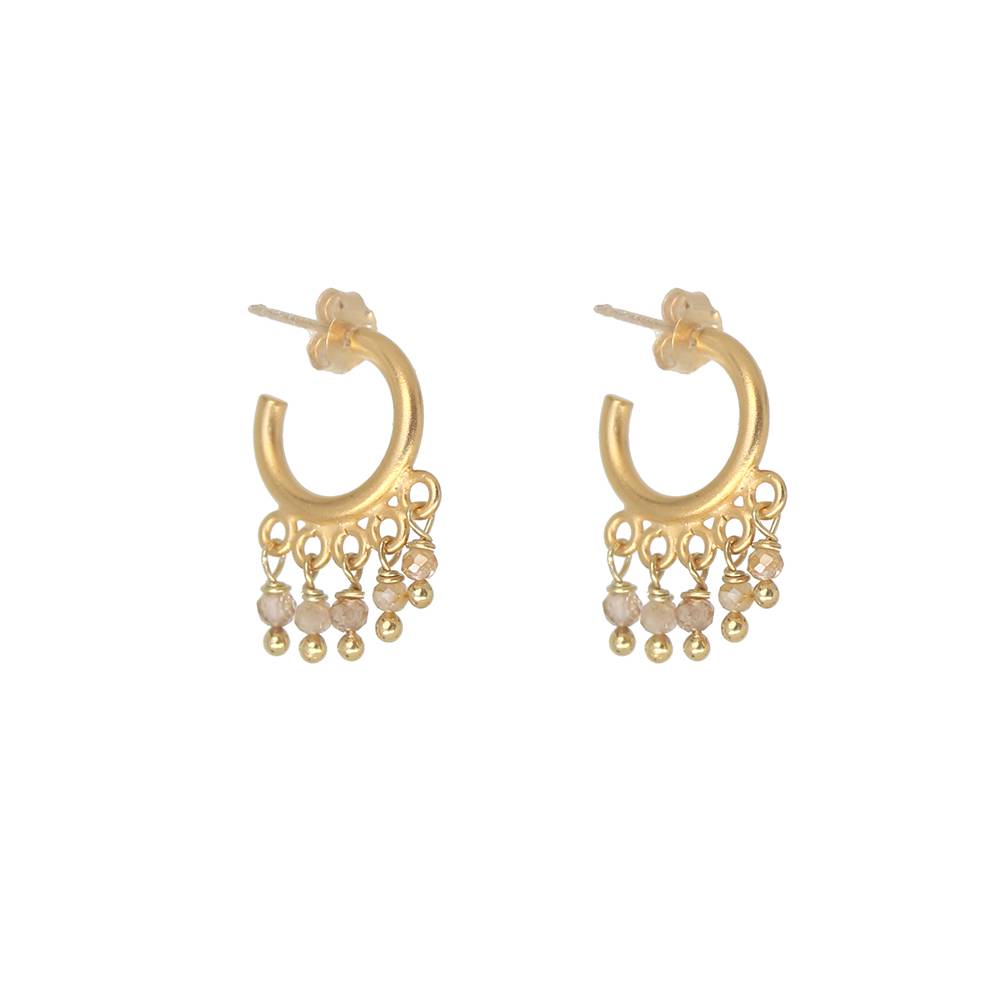 Gold hoop earrings with peach beads on a white background