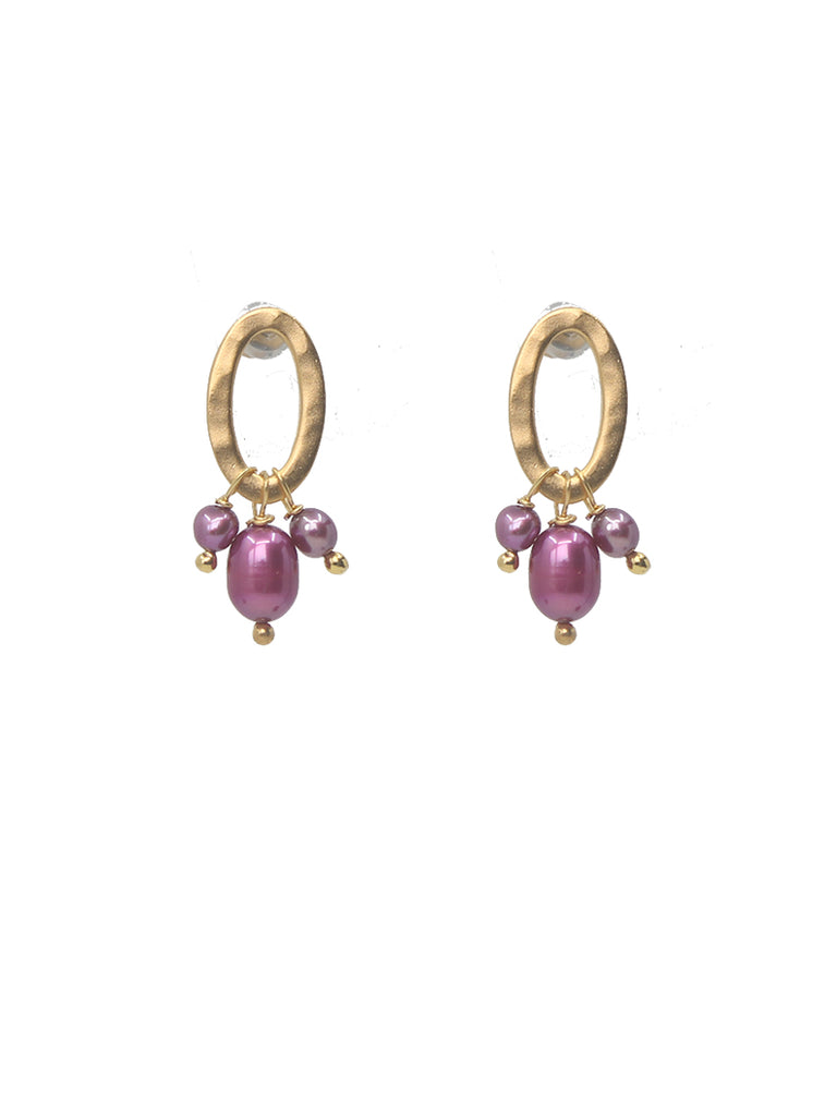 Gold hoop earrings with pink pearls on a white background