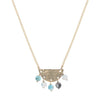 Necklace with a gold chain and semi-circular pendant featuring turquoise beads on a white background