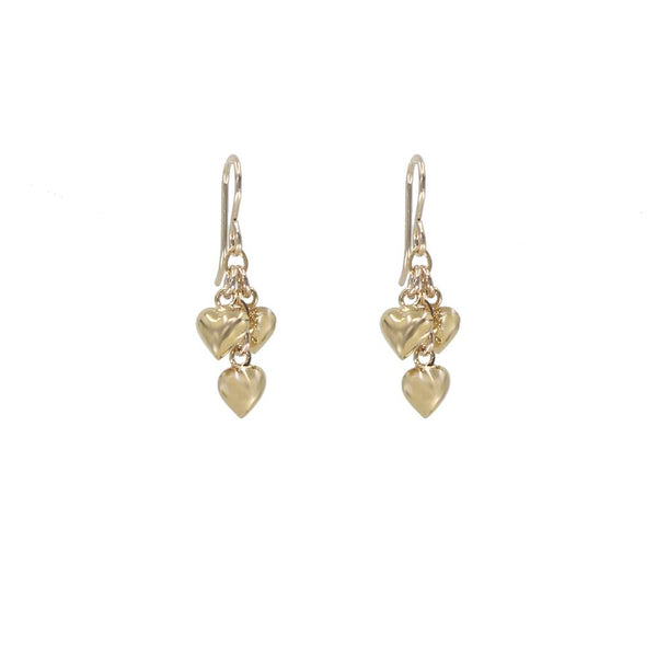 Gold heart-shaped earrings on a white background