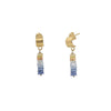 Gold hoop earrings with multicolored bead drops on a white background