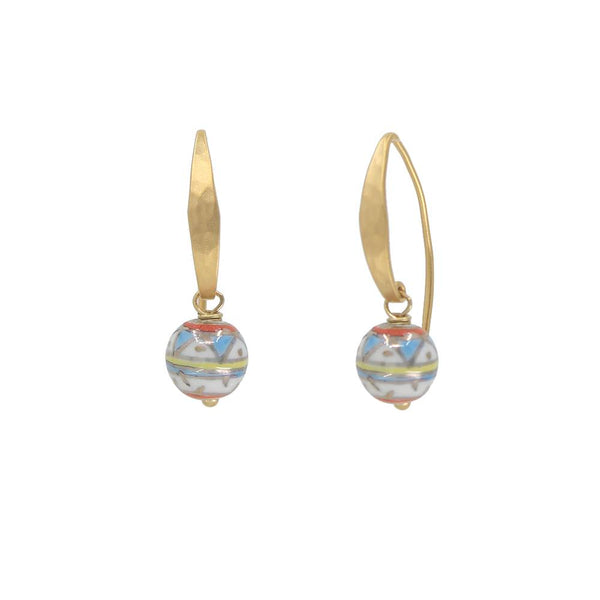 Gold earrings with colorful spherical charms on a white background