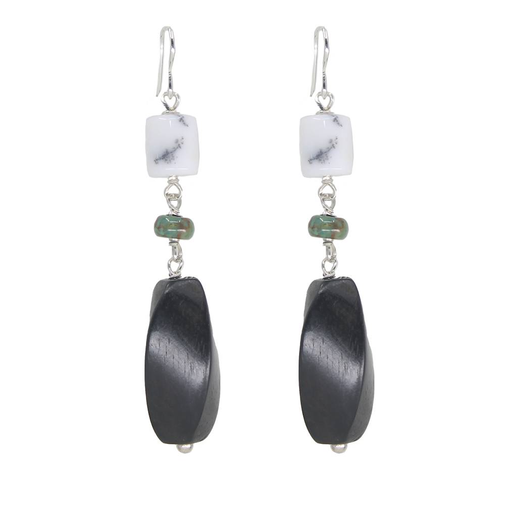 Pair of earrings with black oval beads and white square beads on a white background