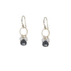 Pair of earrings with black and white stones on a white background