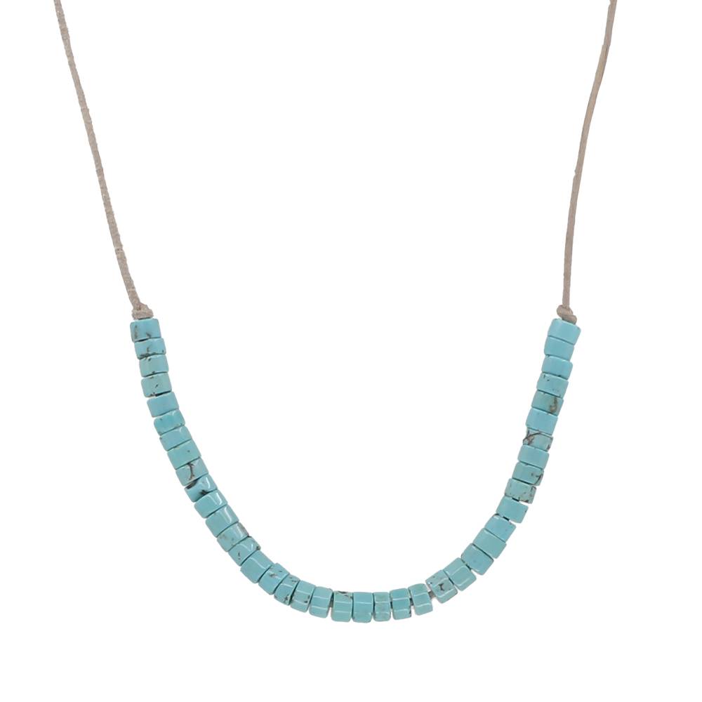 Turquoise beaded necklace on leather cord on a white background