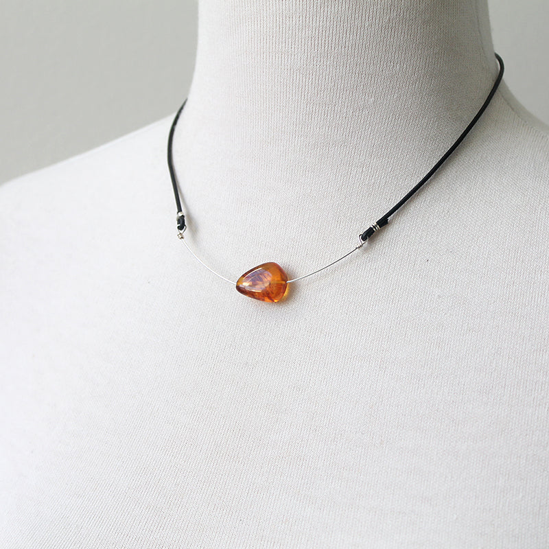 Amber and leather necklace in silver