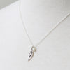 Bird wing charm necklace with pearl