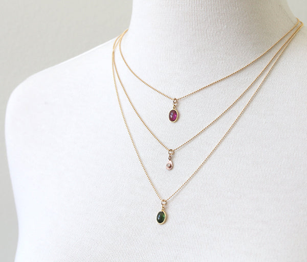 Delicate gemstone necklaces, layered