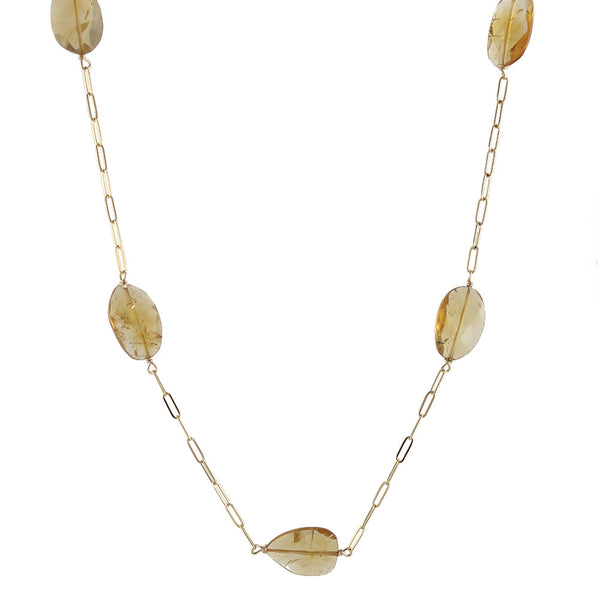 A flat faceted citrine ovals necklace with a gold-filled chain 