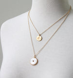 Double coin pendant by peggy li