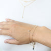Delicate gold layering bracelets by Peggy Li Creations