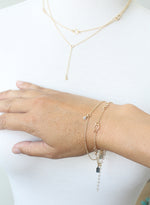 Delicate gold layering bracelets by Peggy Li Creations