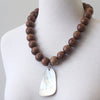Palm wood and shell necklace