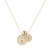 Round gold initial necklace with spacer bead