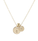 Round gold initial necklace with spacer bead
