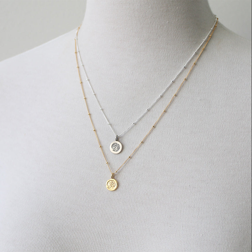 Tiny Om Charm necklaces